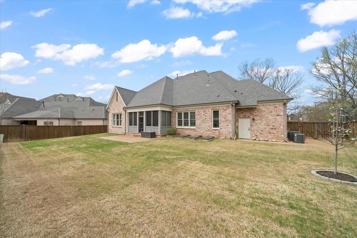 12335 Cascabel Lane Collierville, TN 38017 - Photo 31 of 38 a view of a yard in front of a house with a garden