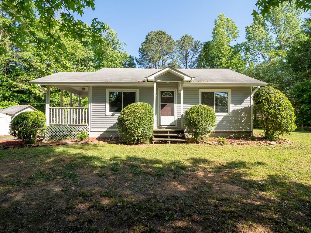619 Poplar Springs Road Hiram, GA 30141 - Photo 1 of 1 a front view of a house with garden
