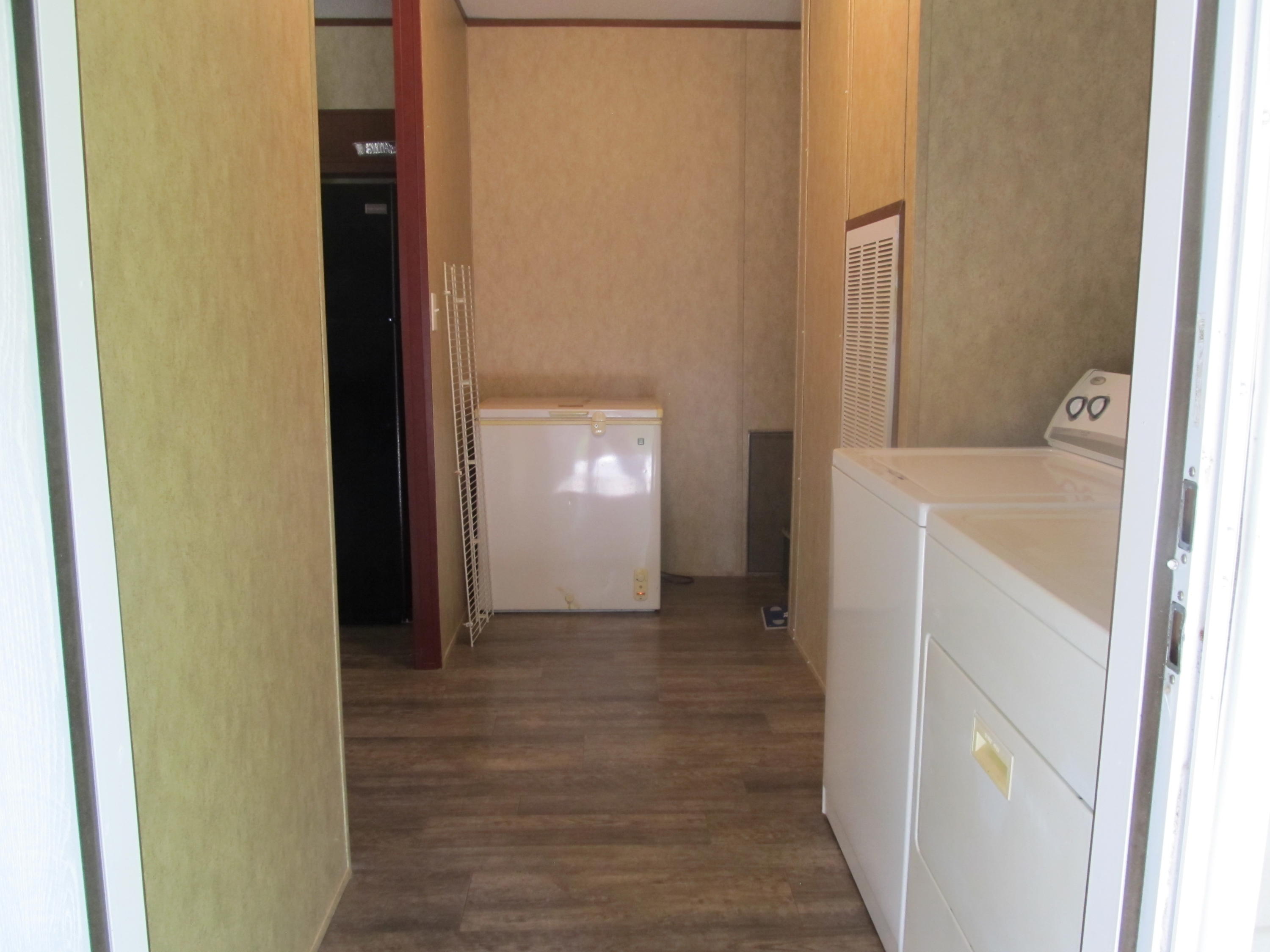32114 Office Road Dozier, AL 36028 - Photo 16 of 24 a view of hallway with washer and dryer