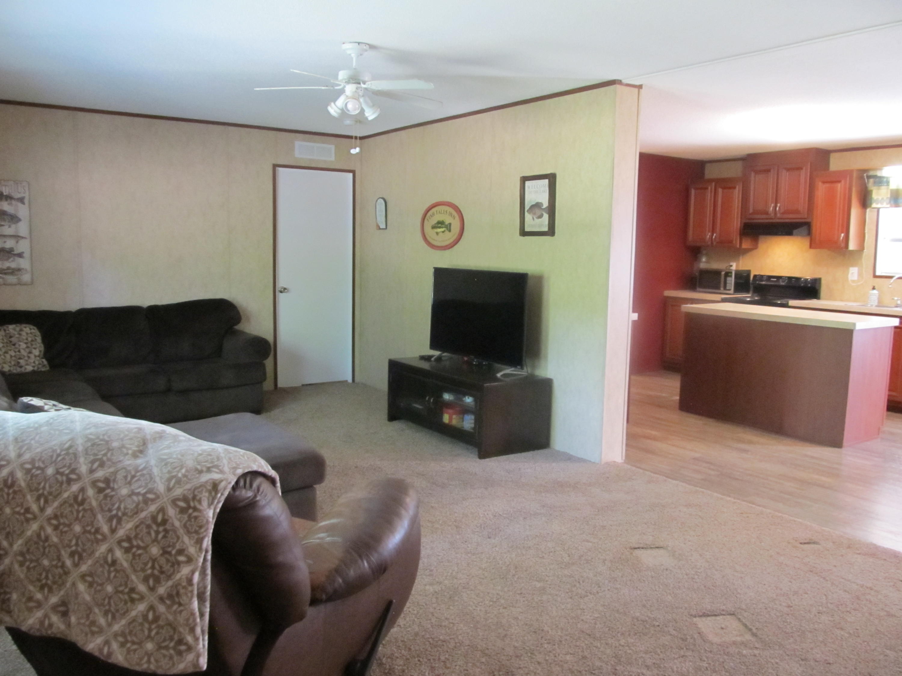 32114 Office Road Dozier, AL 36028 - Photo 4 of 24 a living room with furniture and a flat screen tv