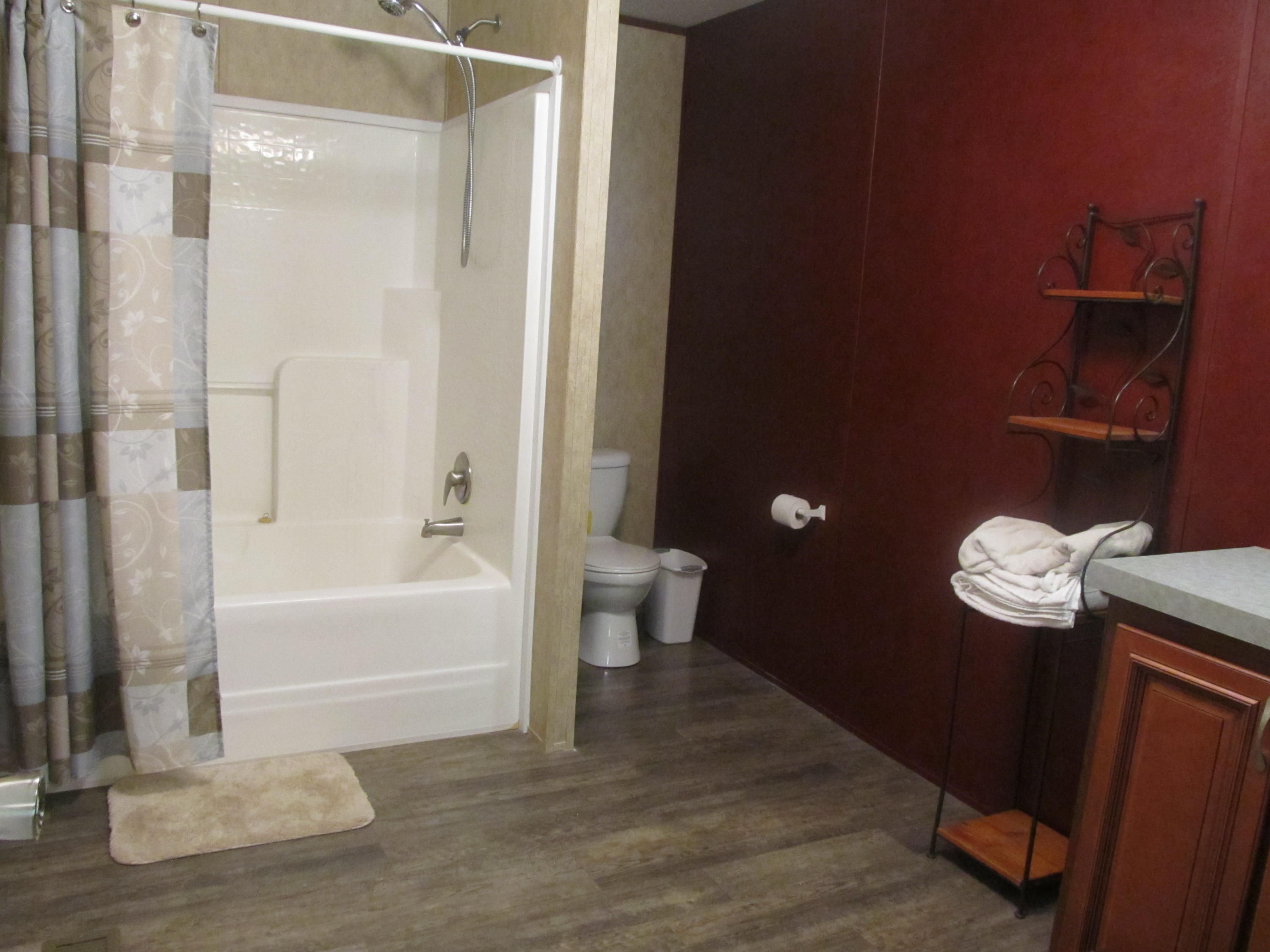 32114 Office Road Dozier, AL 36028 - Photo 10 of 24 a bathroom with a toilet a sink and bathtub