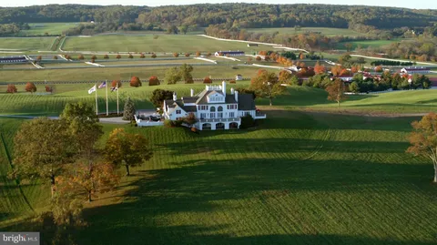 a view of a town with mountains in the background