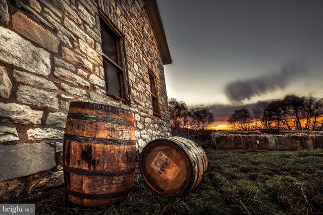 a view of a workspace with furniture and a bookshelf
