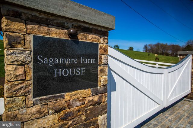 a view of tree in front of a house