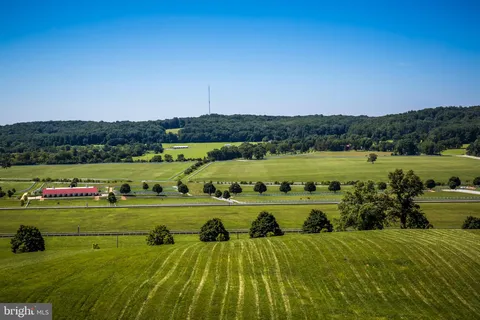 a view of a town with mountains in the background
