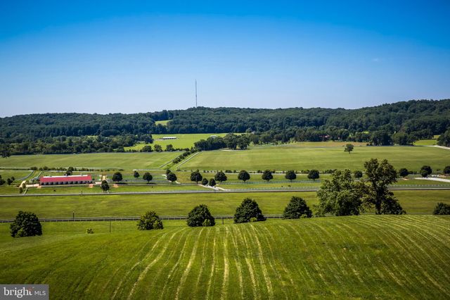 a view of a town with mountains in the background