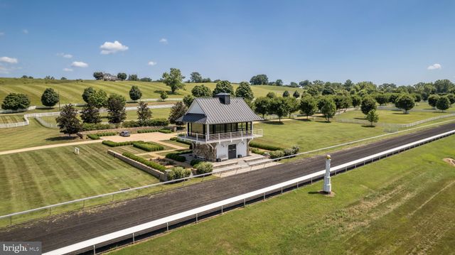 an aerial view of a houses with outdoor space