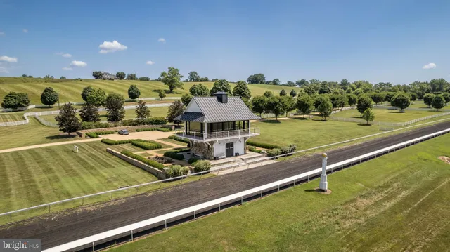 an aerial view of a houses with outdoor space