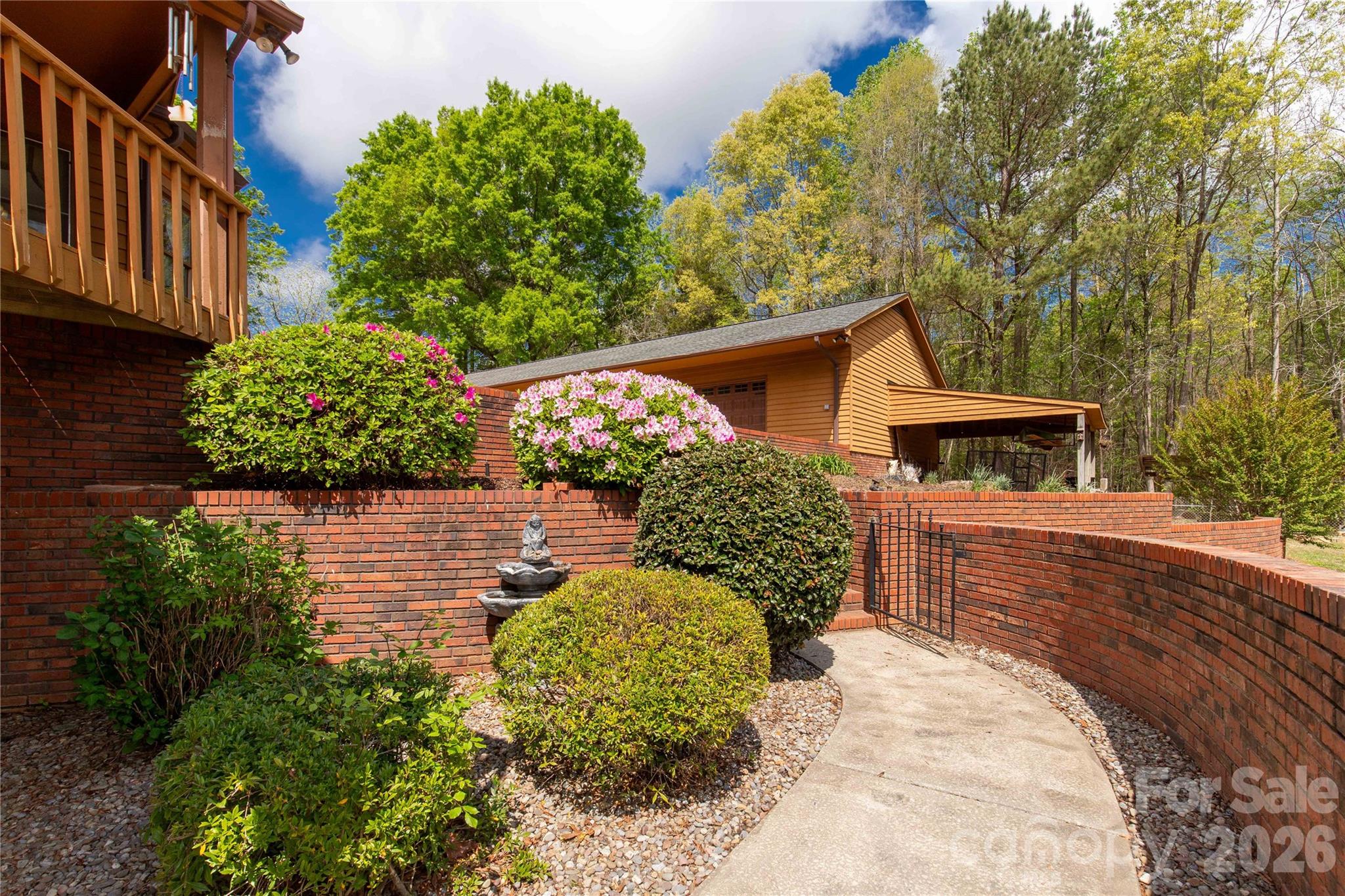 529 Langley Road Lancaster, SC 29720 - Photo 47 of 48 a view of a house with a small yard plants and large tree