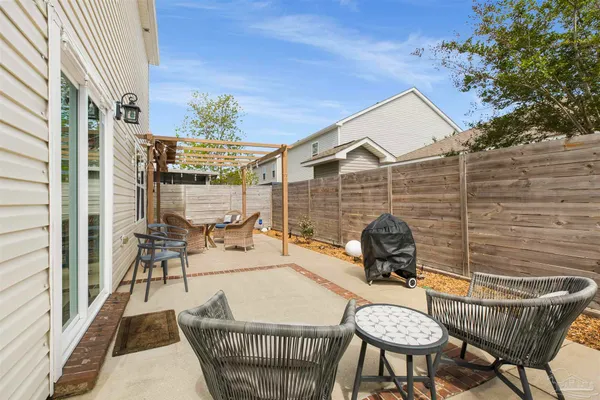 a patio with table and chairs