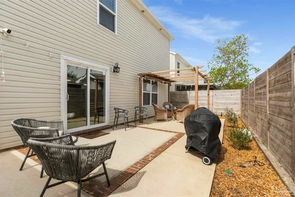 a view of house with patio outdoor seating space
