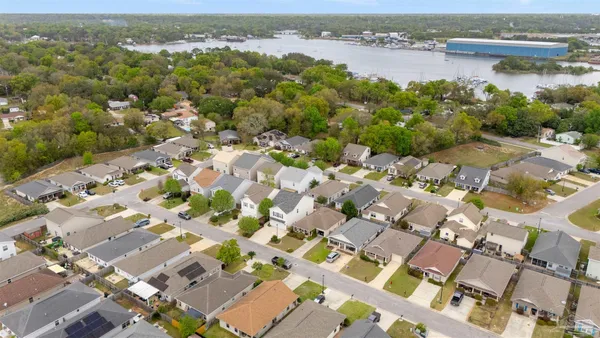 an aerial view of residential houses with outdoor space