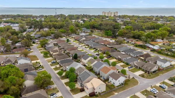 an aerial view of residential houses with outdoor space