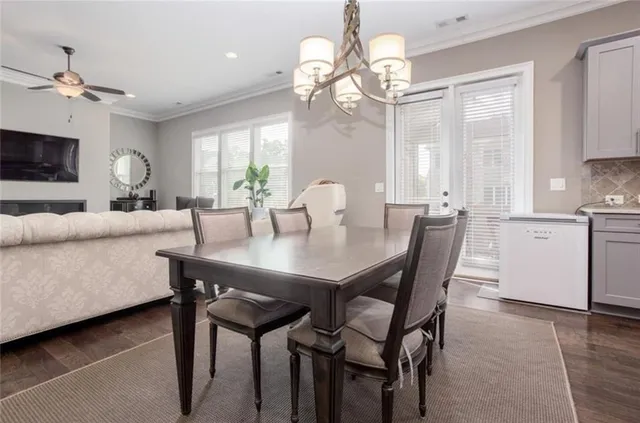 a view of a dining room with furniture window and wooden floor