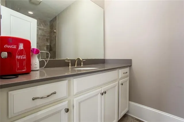 a bathroom with a sink and a mirror