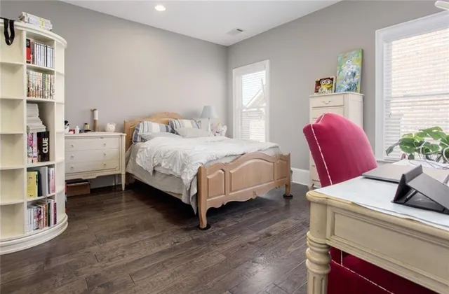 a bedroom with a bed and a couch