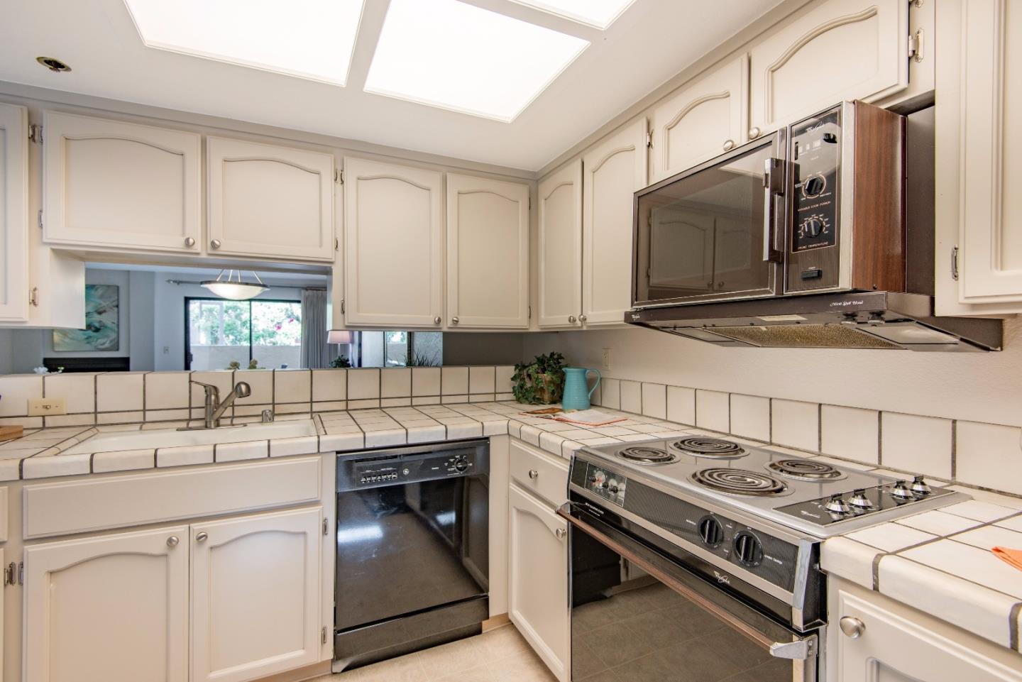 20666 Celeste Circle Cupertino, CA 95014 - Photo 11 of 15 a kitchen with a stove and a sink