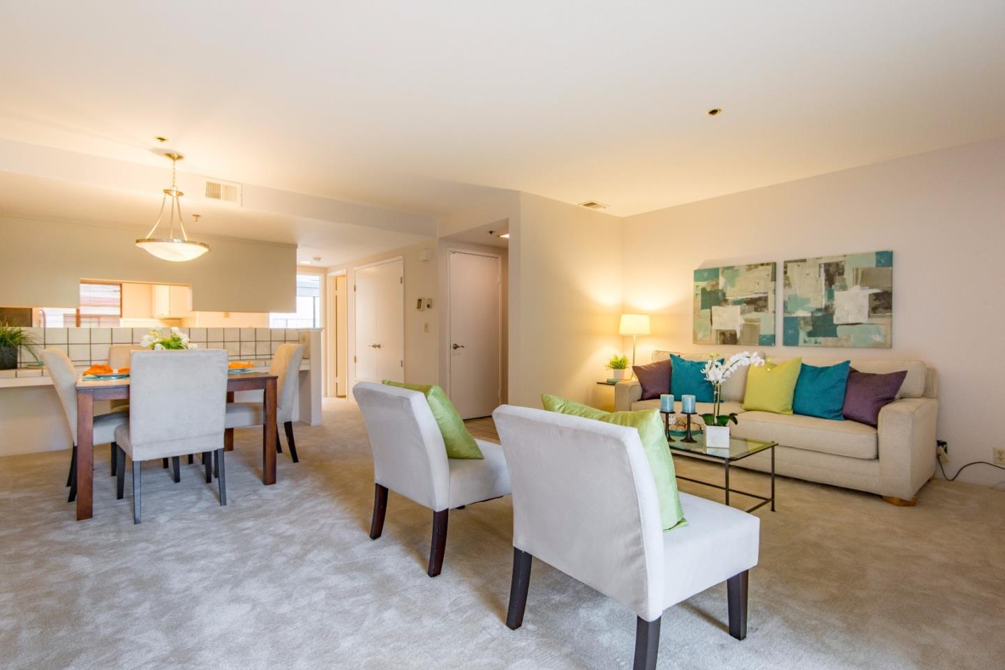 20666 Celeste Circle Cupertino, CA 95014 - Photo 7 of 15 a living room with furniture a lamp and a dining table