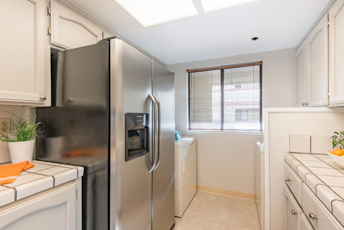 20666 Celeste Circle Cupertino, CA 95014 - Photo 10 of 15 a kitchen with stainless steel appliances granite countertop a refrigerator and a stove