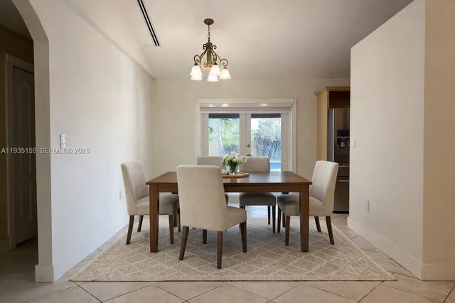 a view of a dining room with furniture and window