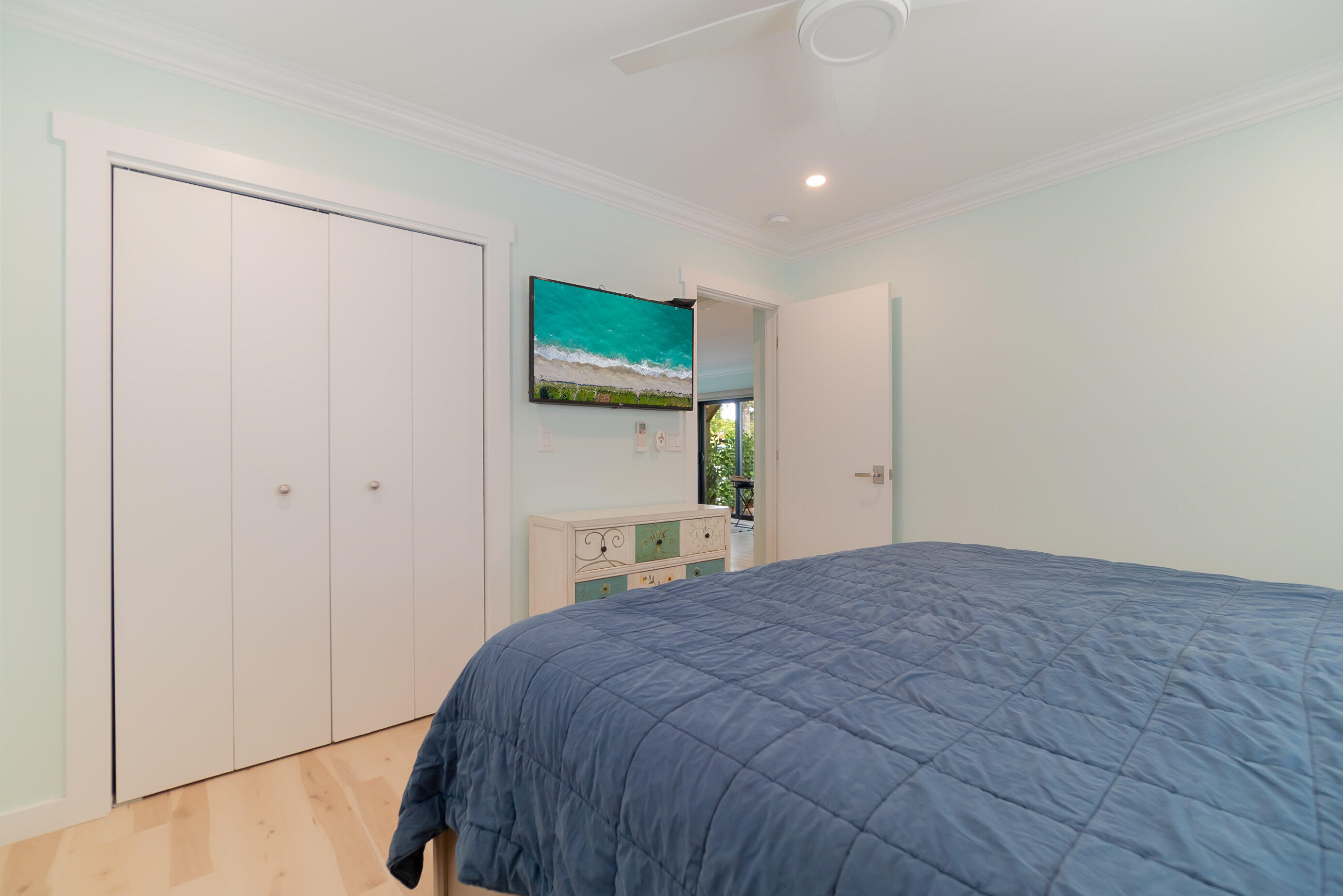 301 South Swinton Avenue Delray Beach, FL 33444 - Photo 15 of 29 a bedroom with a bed and a painting on the wall