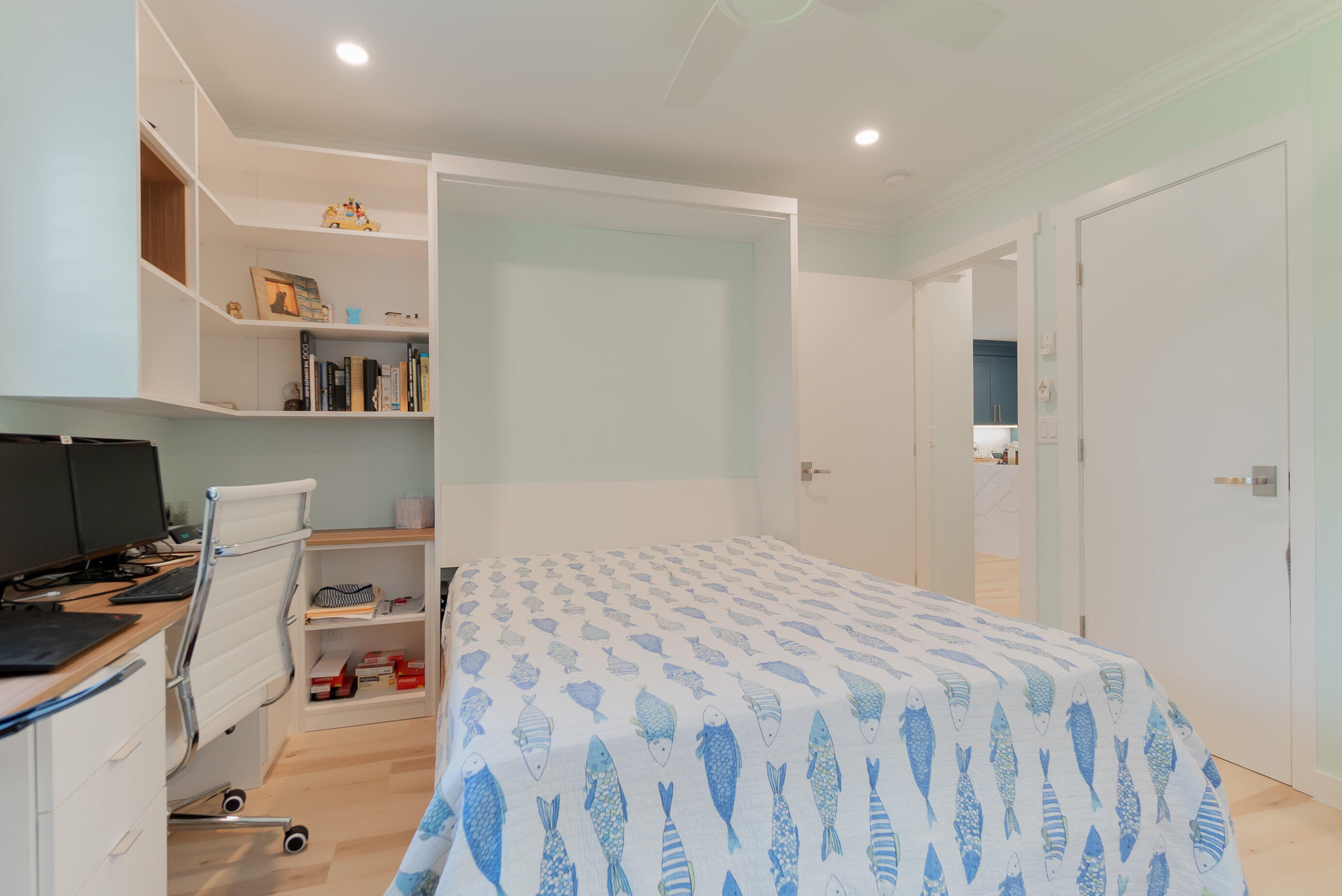 301 South Swinton Avenue Delray Beach, FL 33444 - Photo 16 of 29 a bedroom with a bed and a computer on the desk