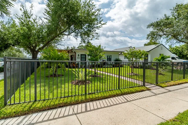 a view of a wrought iron bridge
