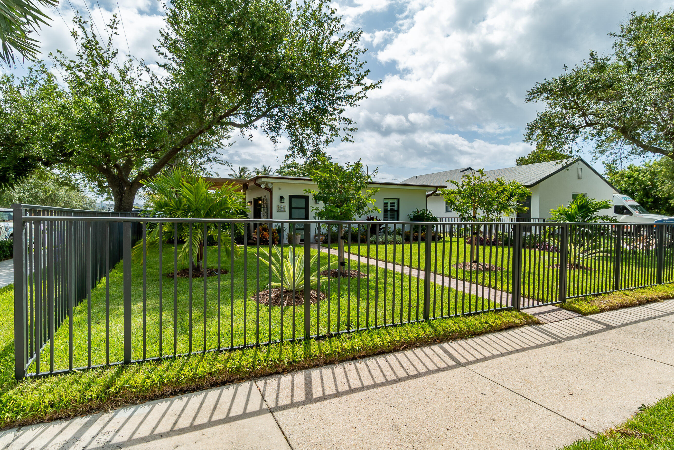 301 South Swinton Avenue Delray Beach, FL 33444 - Photo 2 of 29 a view of a wrought iron bridge