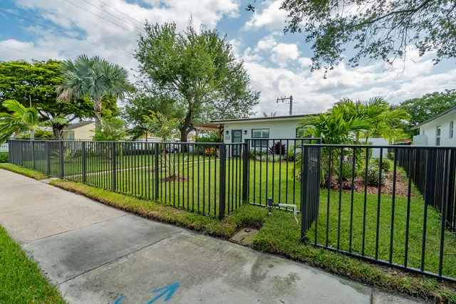 a view of a wrought iron fences in front of house