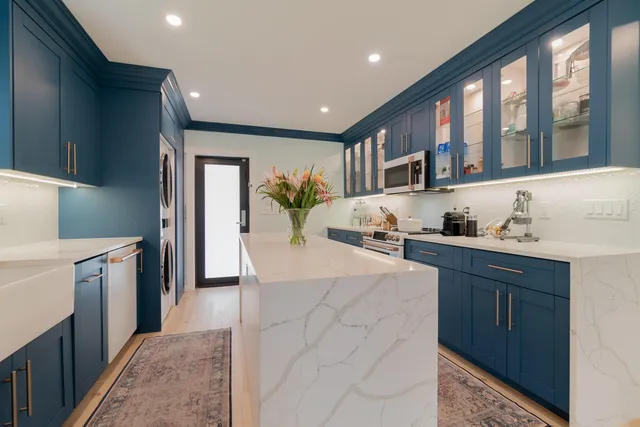 a view of a kitchen washer and dryer