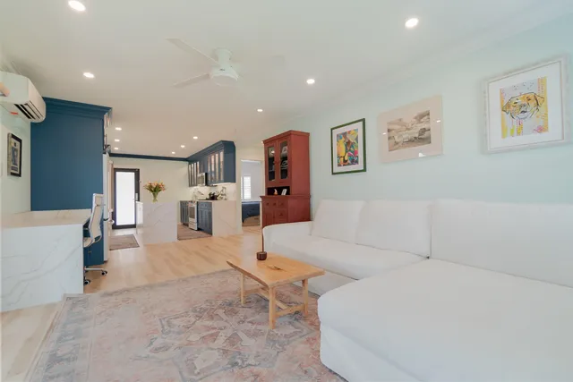 a living room with furniture and entry gate
