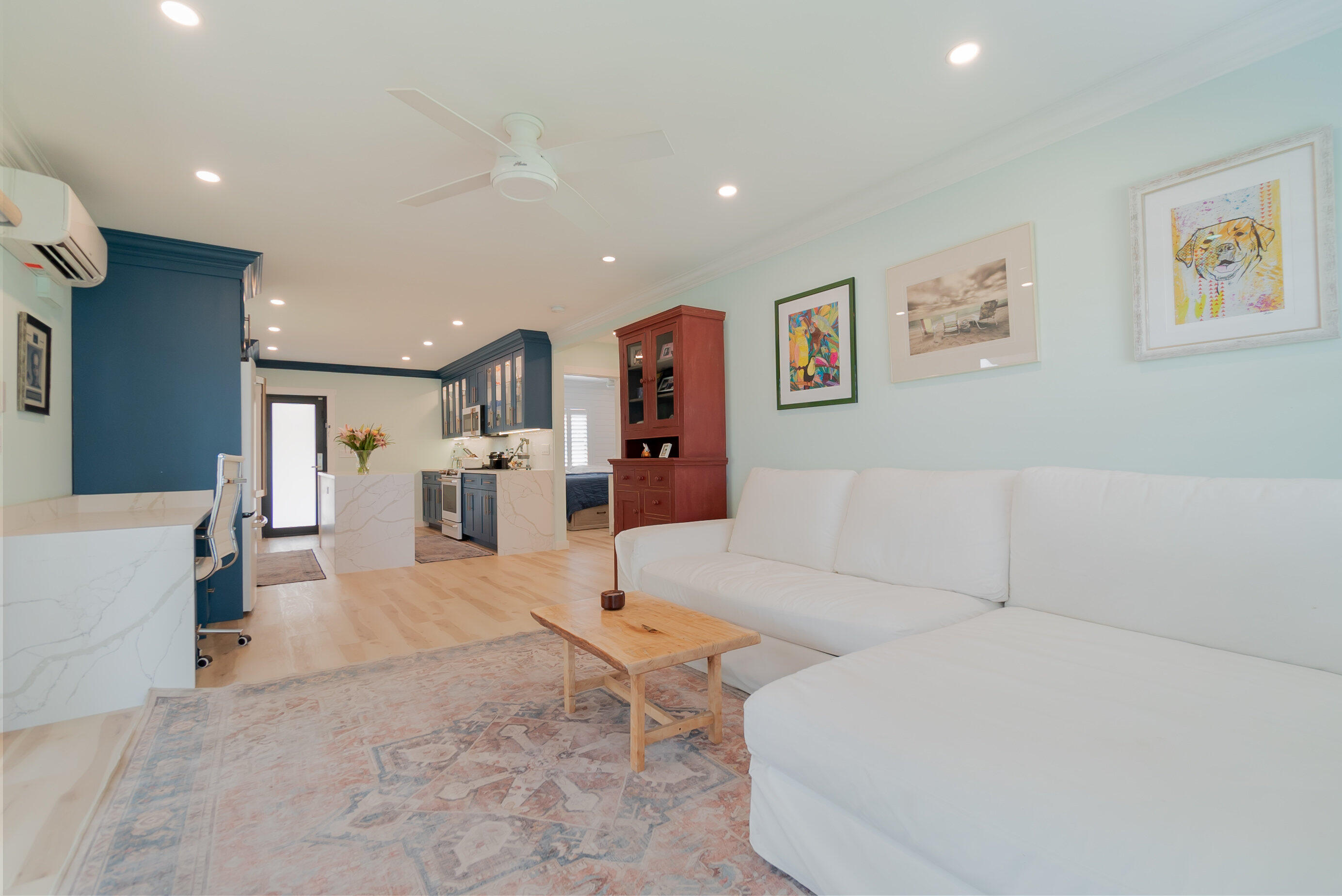 301 South Swinton Avenue Delray Beach, FL 33444 - Photo 10 of 29 a living room with furniture and kitchen view
