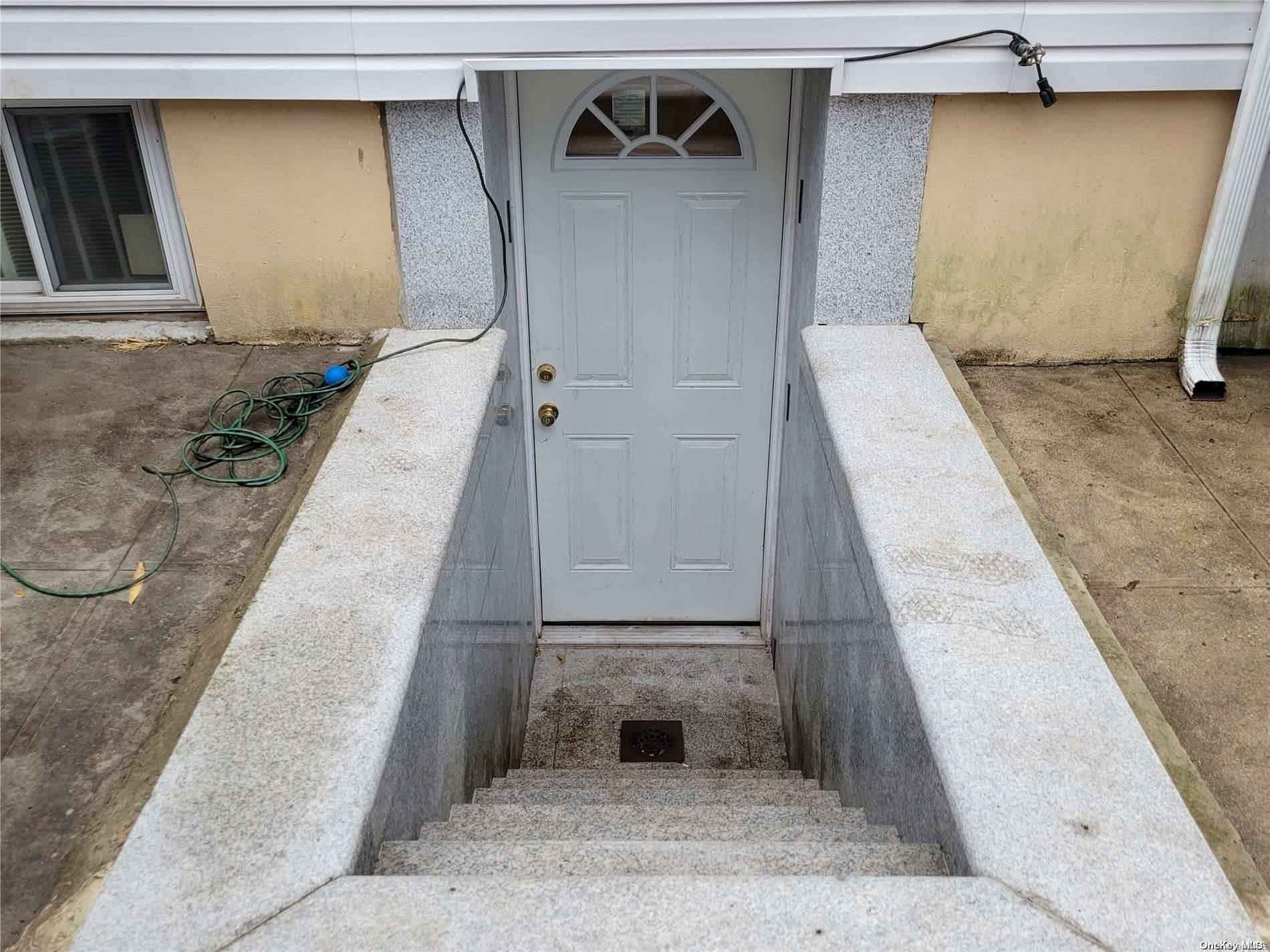 85-30 79th Street Queens, NY 11421 - Photo 20 of 23 a view of a door front of house