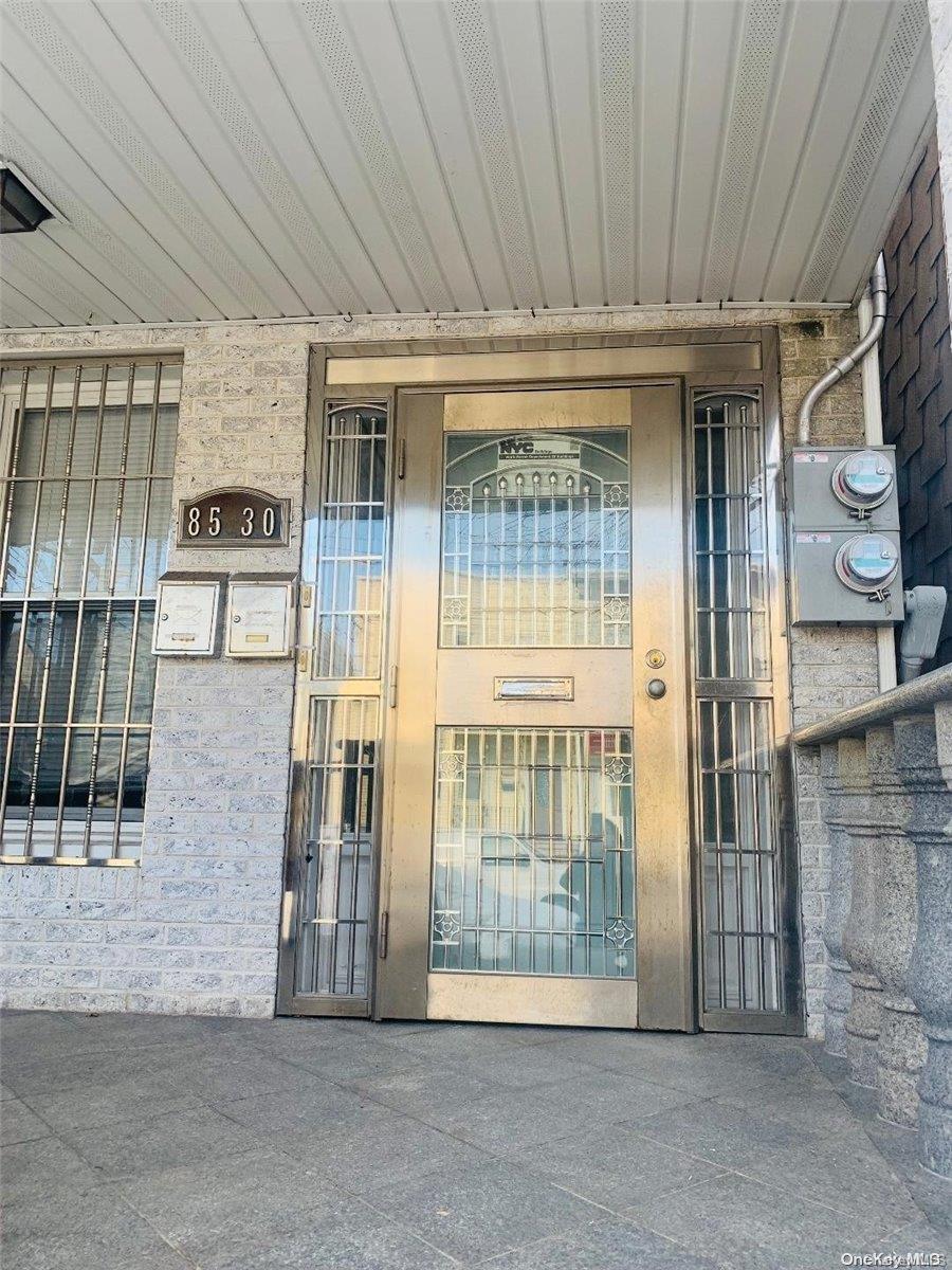 85-30 79th Street Queens, NY 11421 - Photo 2 of 23 a view of a building with door