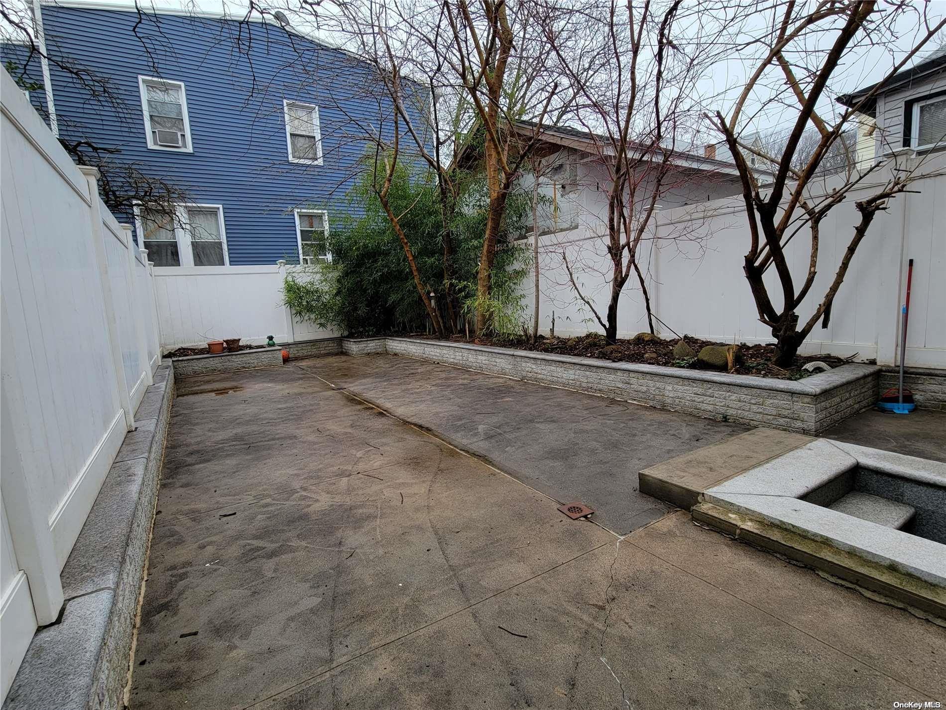 85-30 79th Street Queens, NY 11421 - Photo 21 of 23 a view of a street with a building