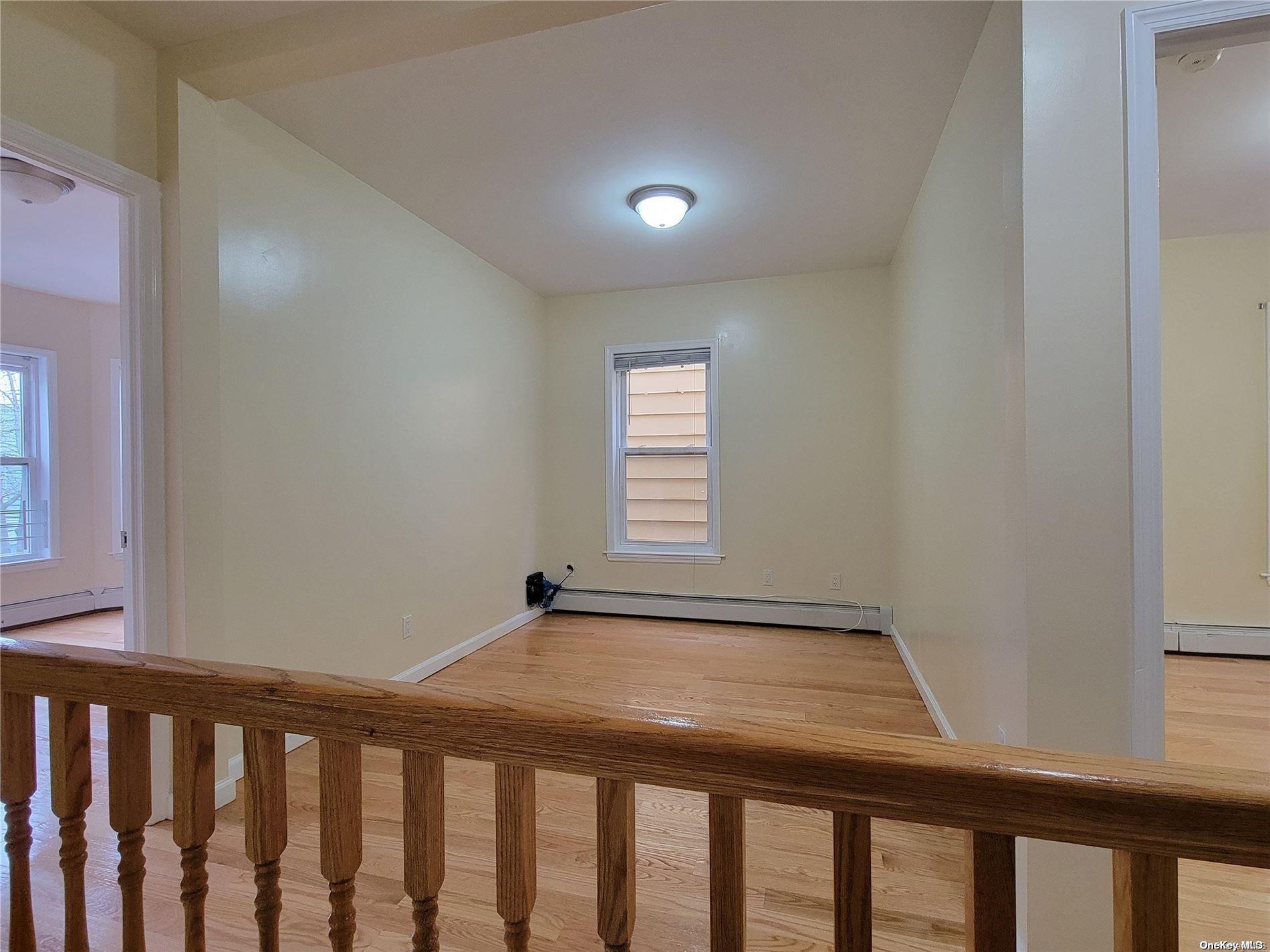 85-30 79th Street Queens, NY 11421 - Photo 7 of 23 a view of a hallway with a window