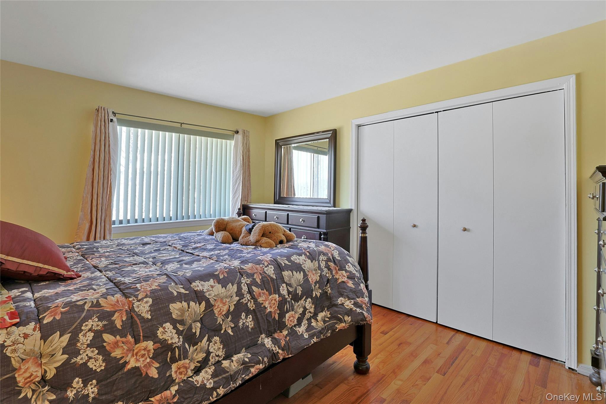 31 Powder Horn Road Cortlandt Manor, NY 10567 - Photo 17 of 38 a bedroom with a bed and wooden floor