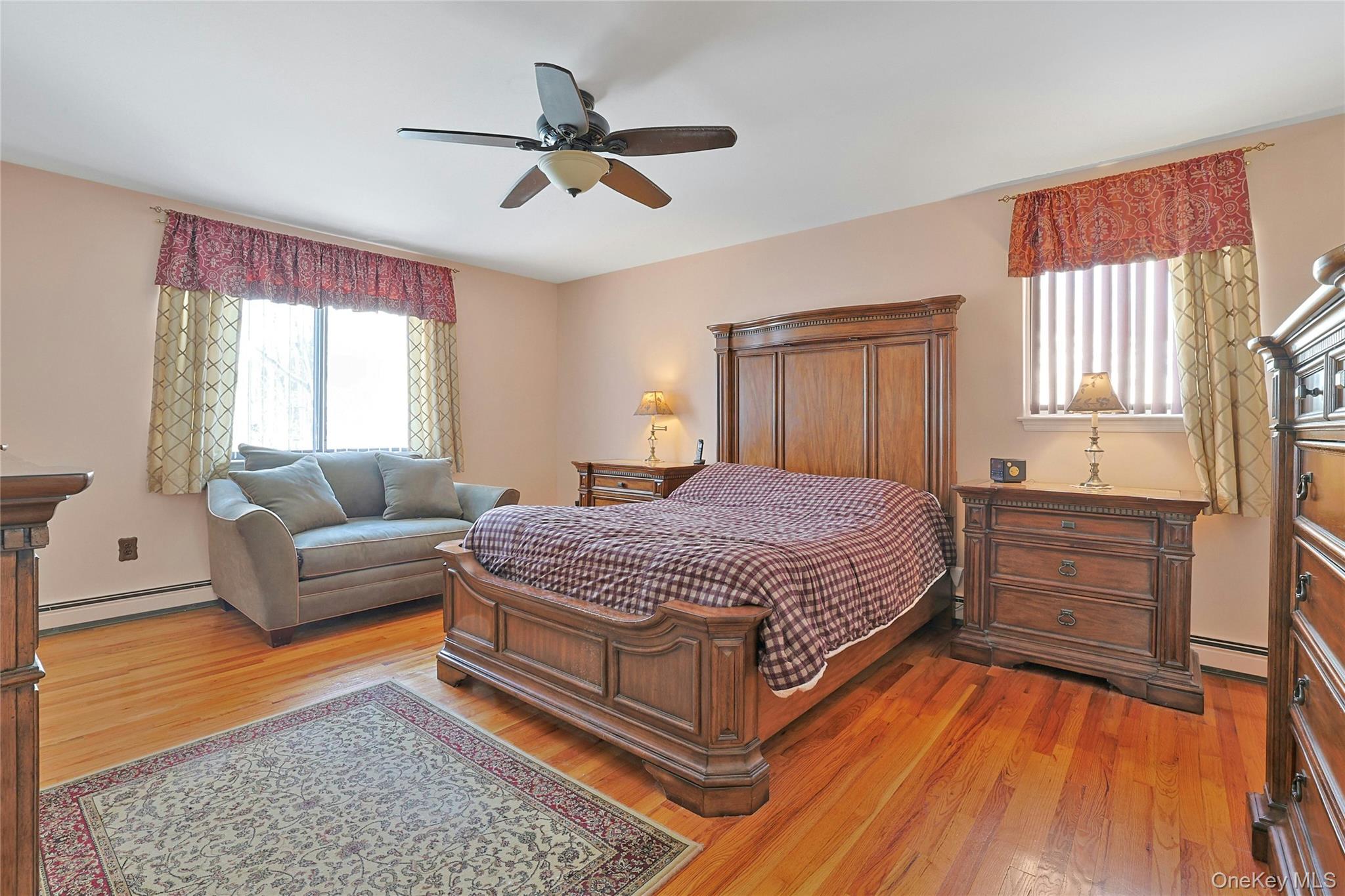 31 Powder Horn Road Cortlandt Manor, NY 10567 - Photo 18 of 36 Bedroom featuring hardwood floors, and a ceiling fan