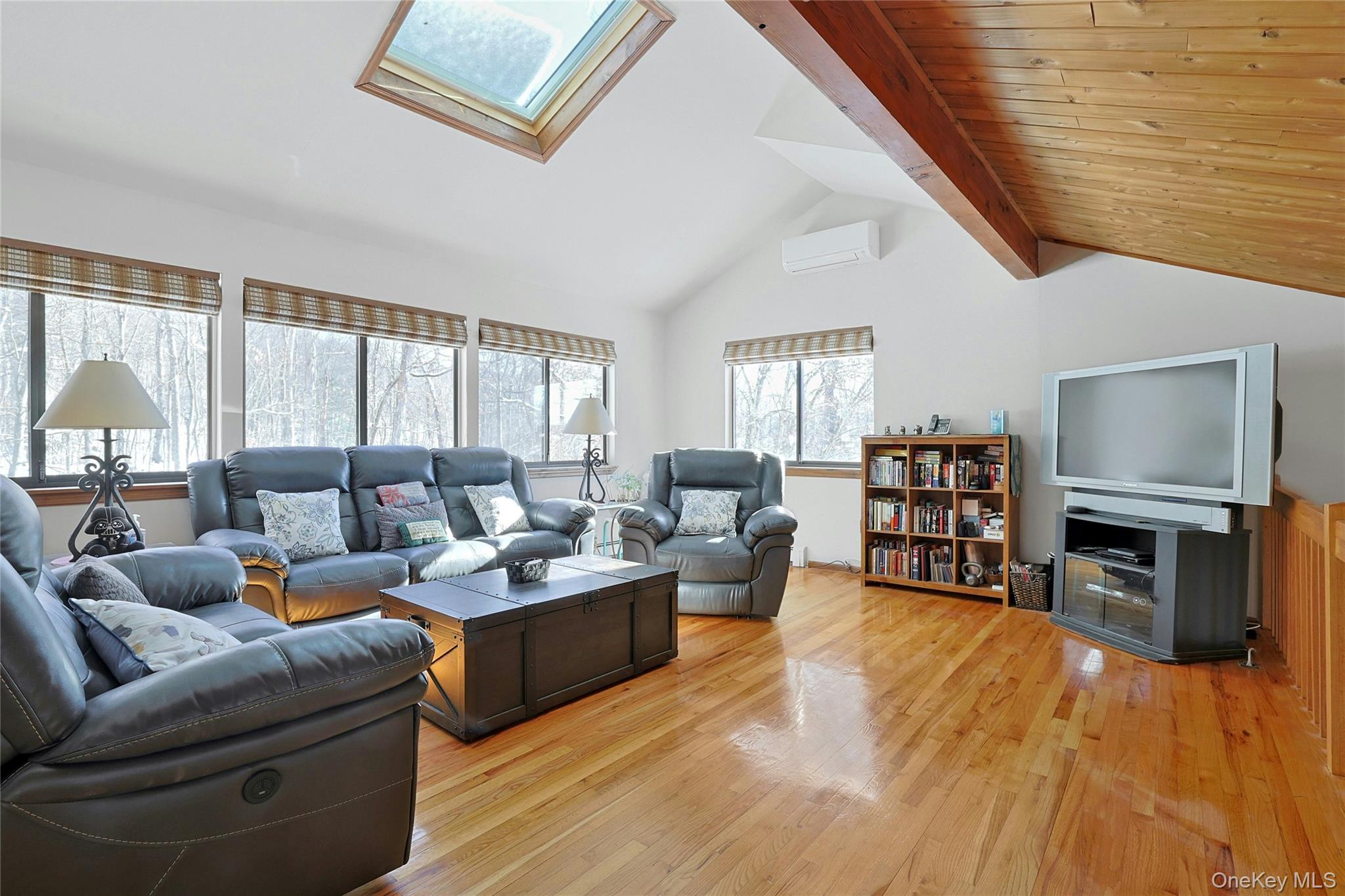 31 Powder Horn Road Cortlandt Manor, NY 10567 - Photo 21 of 36 Loft area with a skylight, light wood-style floors, and wood ceiling