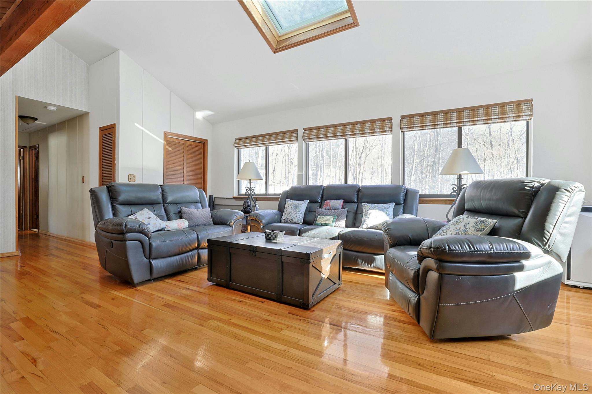 31 Powder Horn Road Cortlandt Manor, NY 10567 - Photo 22 of 36 Loft featuring a skylight, light wood-type flooring, and high vaulted ceiling