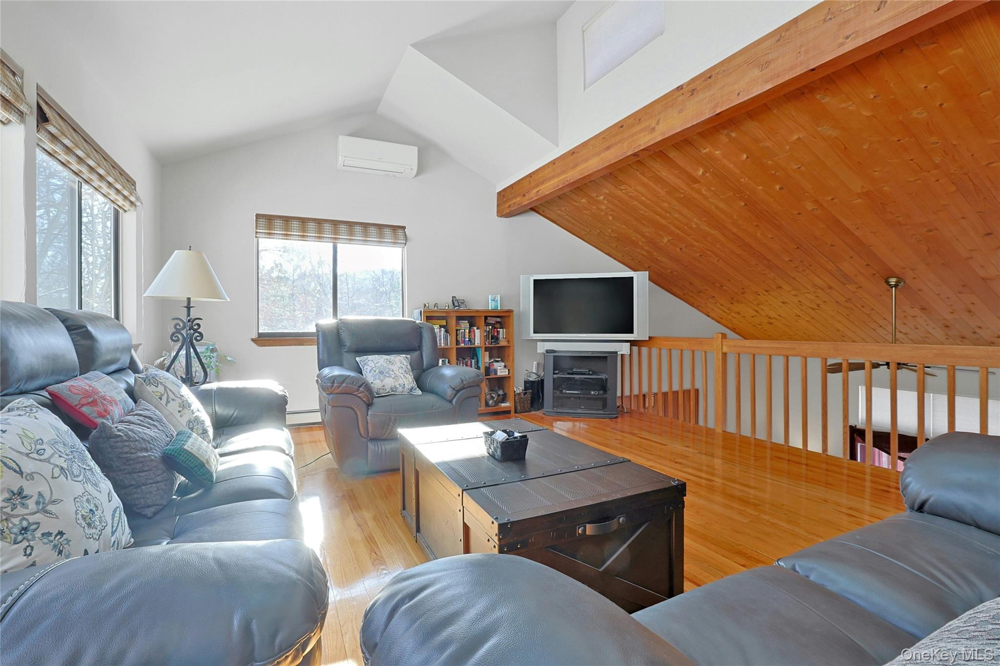 31 Powder Horn Road Cortlandt Manor, NY 10567 - Photo 23 of 36 Living room with light wood finished floors and a baseboard
