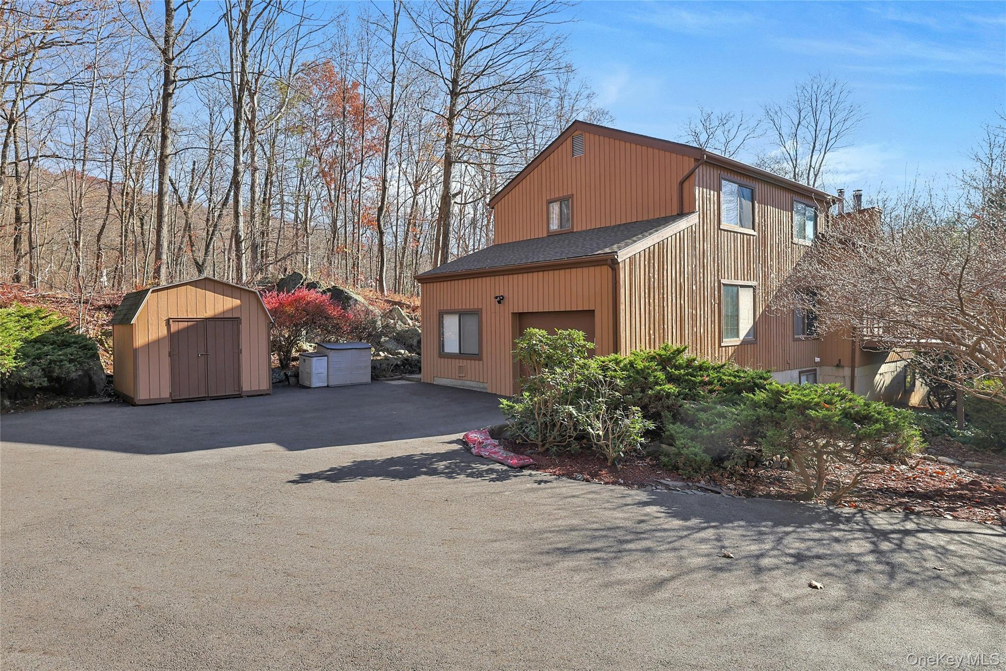 31 Powder Horn Road Cortlandt Manor, NY 10567 - Photo 35 of 38 a couple of potted plants sitting in front of a house