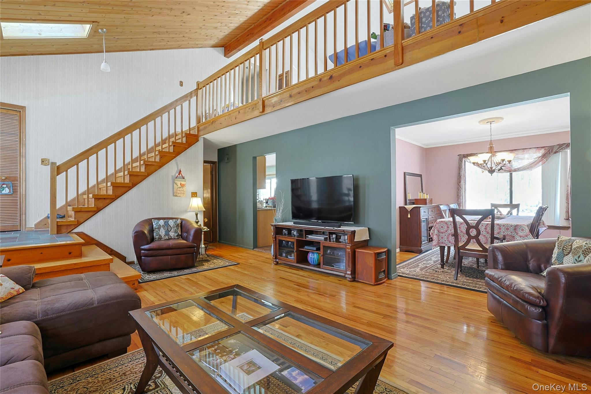31 Powder Horn Road Cortlandt Manor, NY 10567 - Photo 4 of 38 a living room with furniture and a flat screen tv