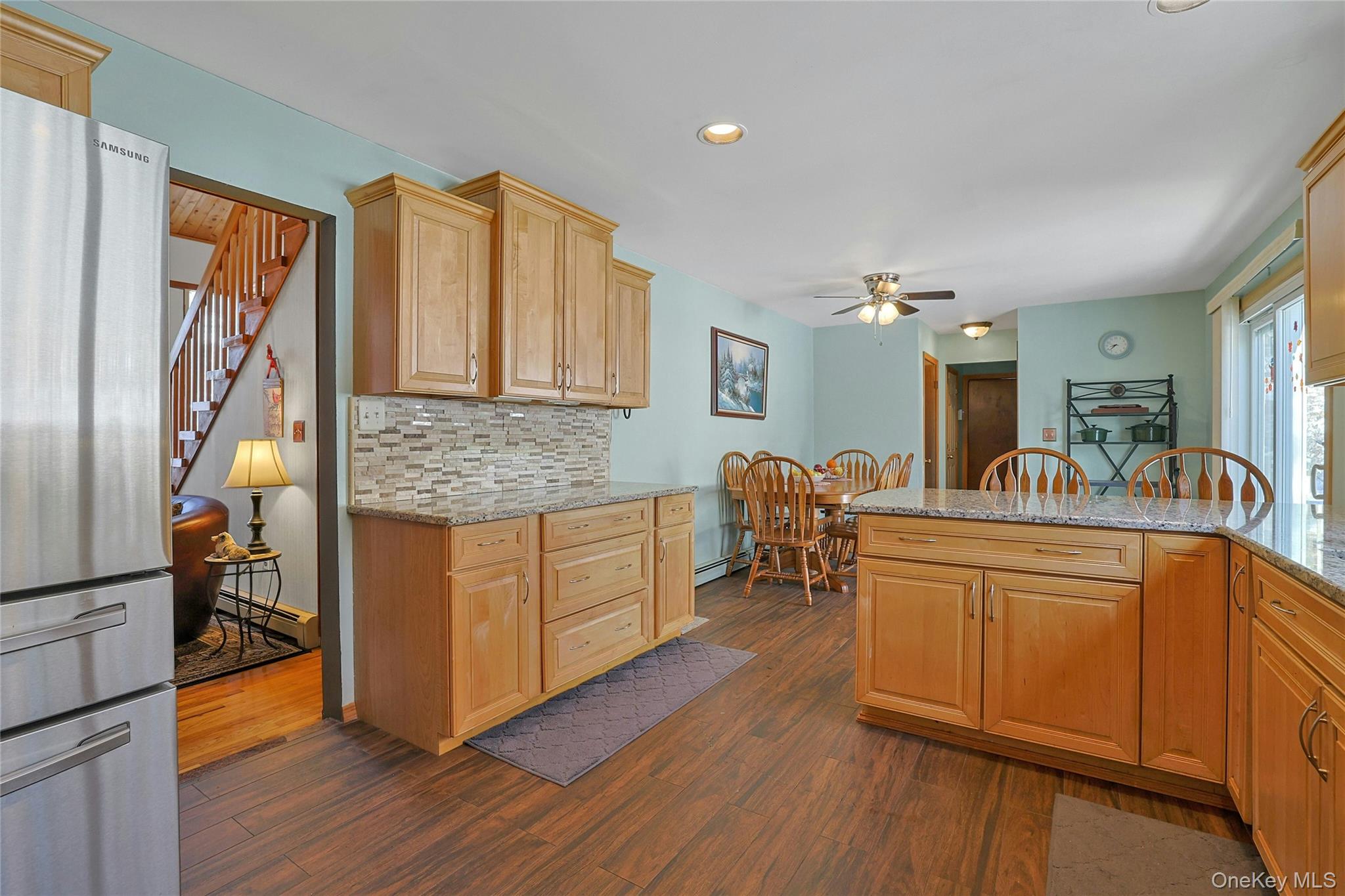 31 Powder Horn Road Cortlandt Manor, NY 10567 - Photo 6 of 38 a kitchen with stainless steel appliances granite countertop a sink cabinets and wooden floor