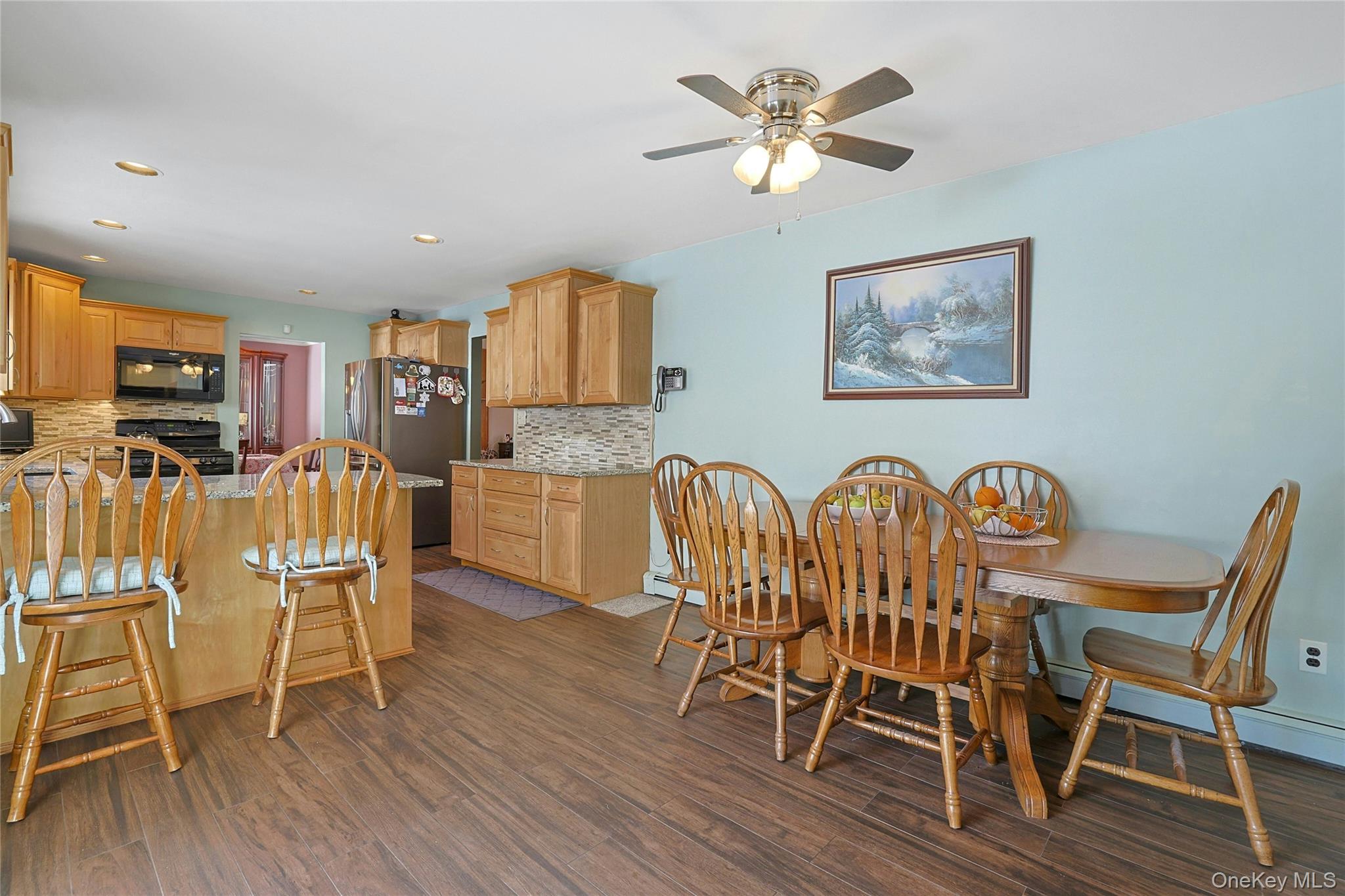31 Powder Horn Road Cortlandt Manor, NY 10567 - Photo 10 of 38 a dining room with furniture a chandelier and wooden floor
