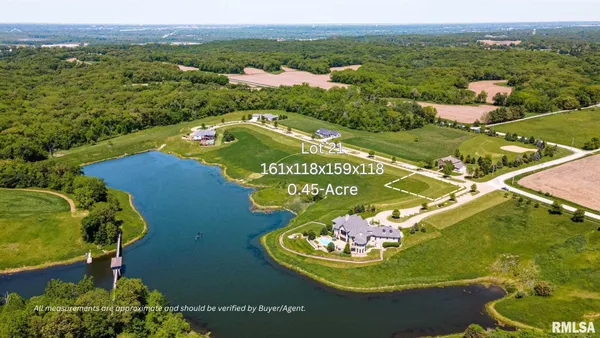 a view of a swimming pool with a yard and lake view