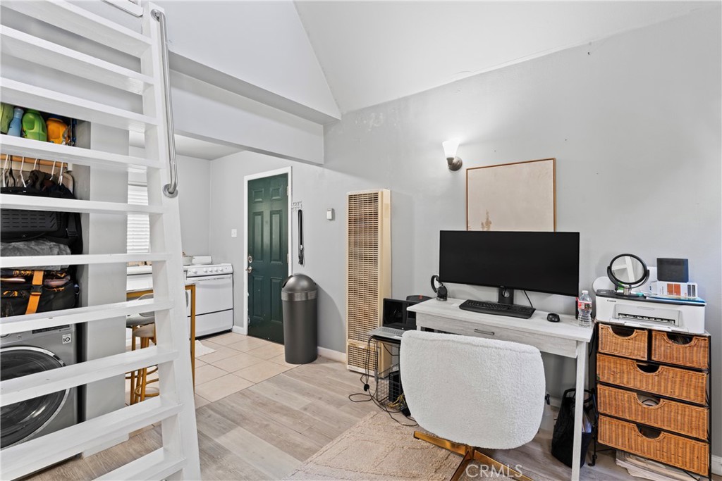 1286 Lovers Lane Rimforest, CA 92378 - Photo 18 of 27 a view of a workspace with furniture and a window