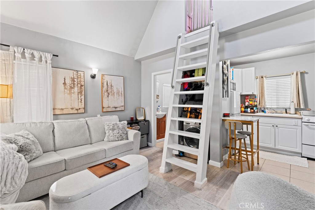 1286 Lovers Lane Rimforest, CA 92378 - Photo 19 of 27 a living room with furniture and cabinets