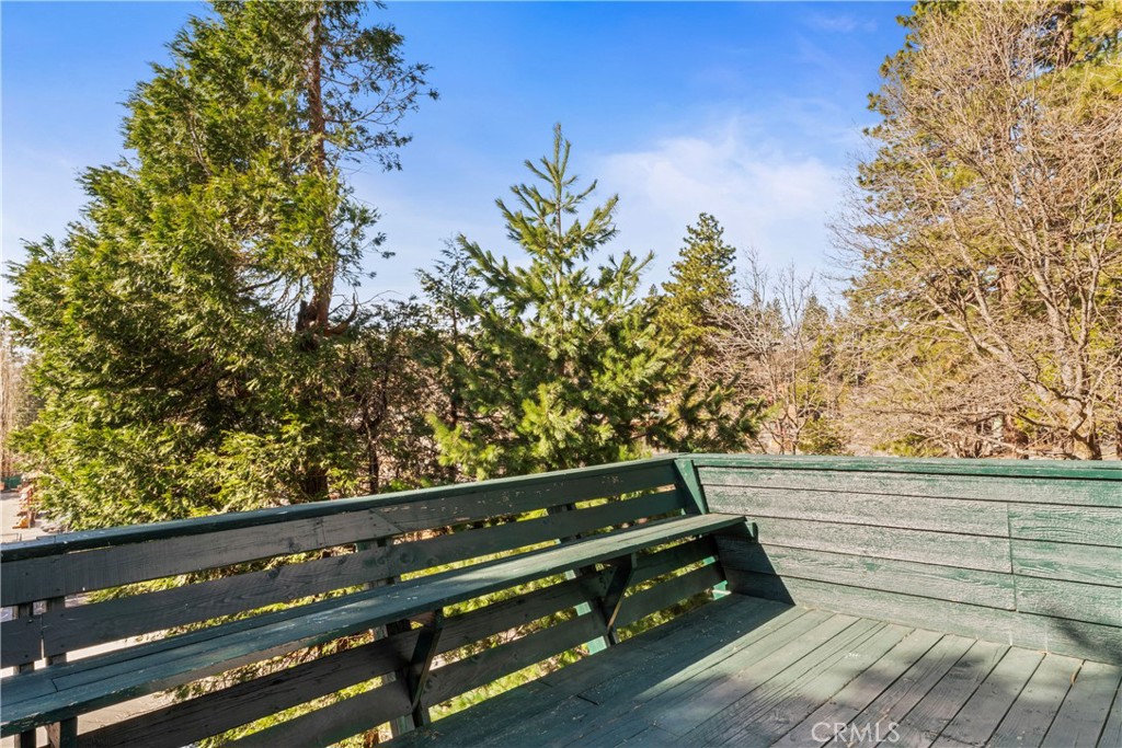 1286 Lovers Lane Rimforest, CA 92378 - Photo 23 of 27 a view of a wooden bench and trees in the background