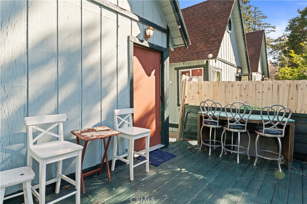 1286 Lovers Lane Rimforest, CA 92378 - Photo 27 of 27 a dining room with furniture and wooden floor